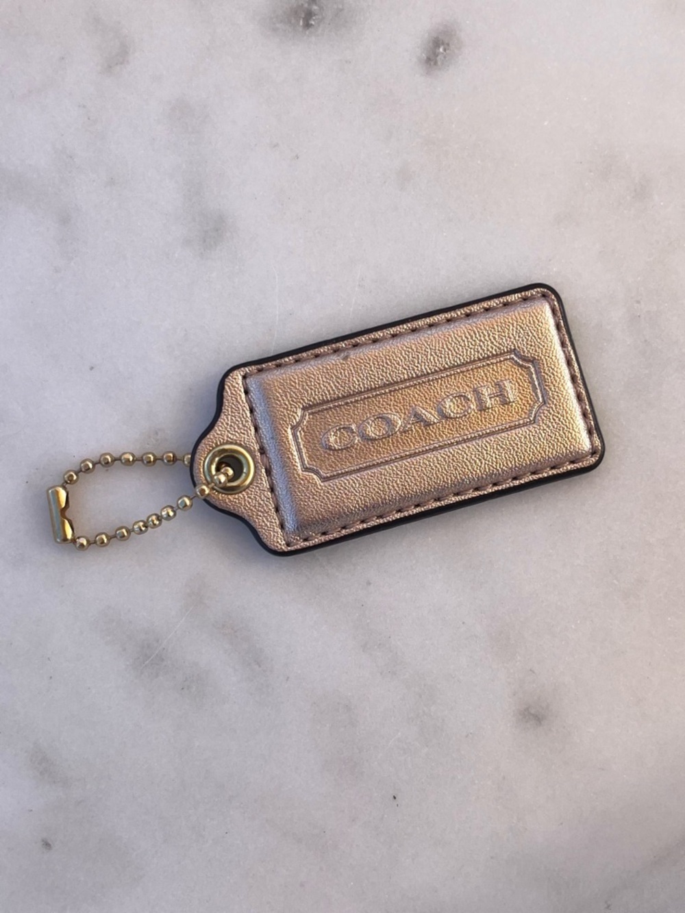 COACH Vintage Metallic Leather Hang Tag, Light Gold